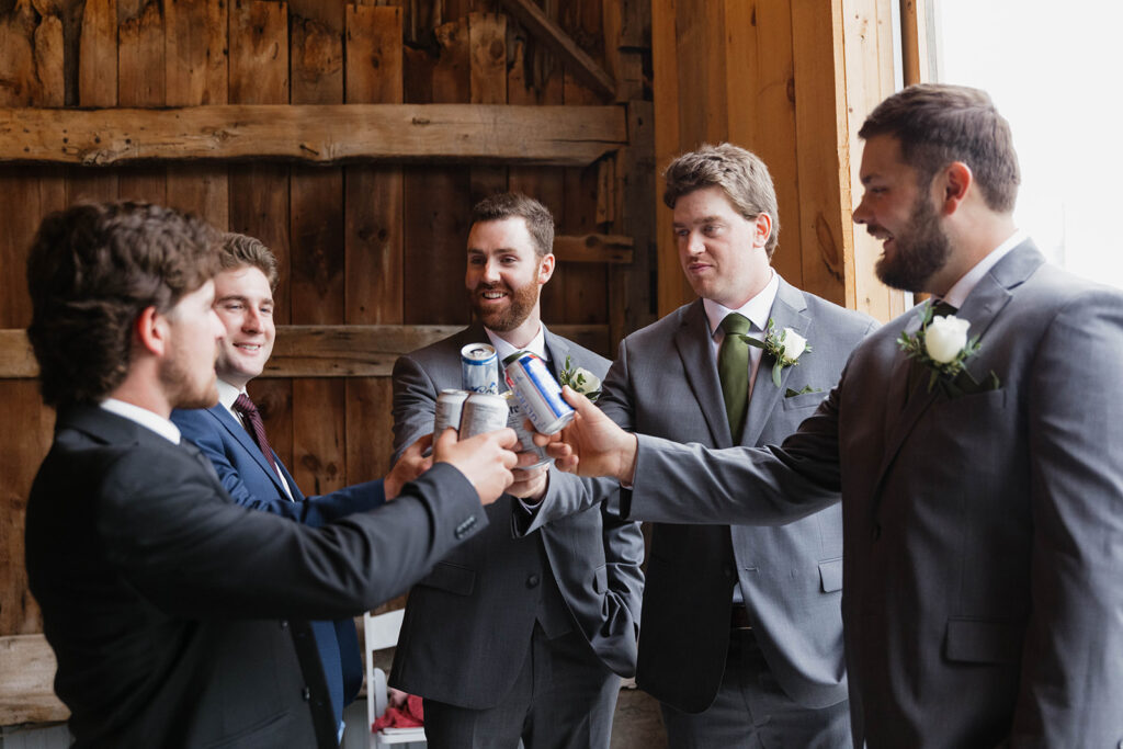 groomsmen cheer-sing with beer at Homestead 1880 in Ottawa, ON.