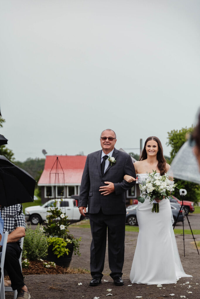 Bride walking down aisle at Homestead 1880 in Ottawa, ON.