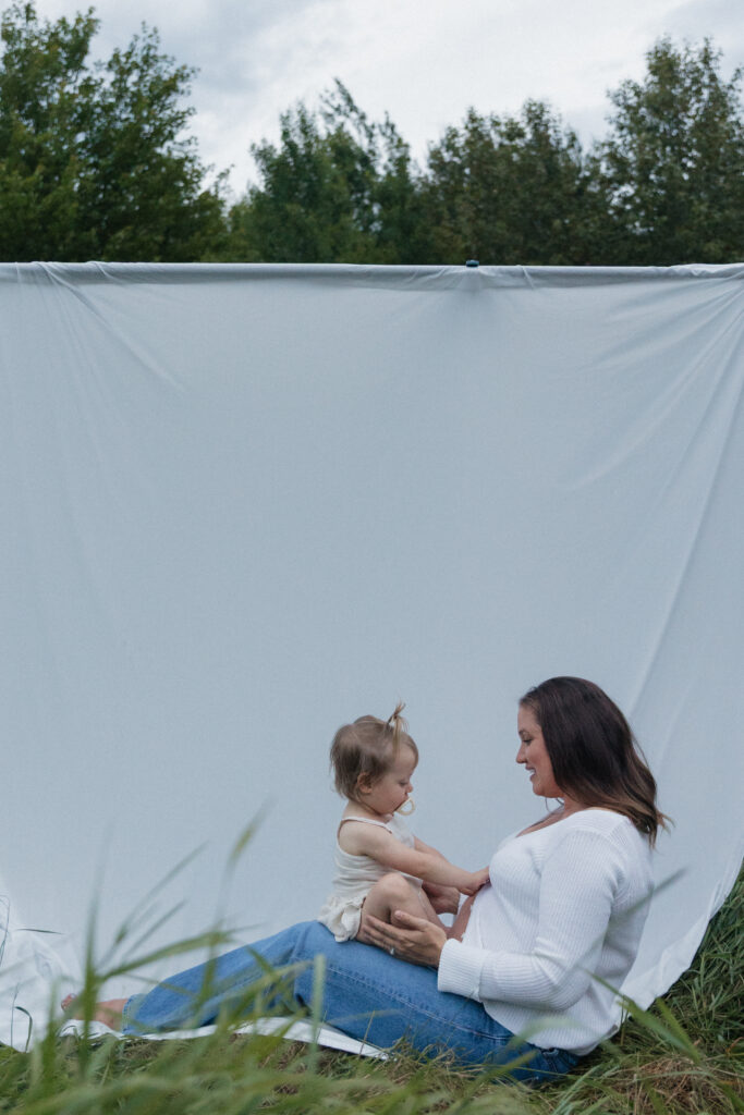 white sheet in the field in Pembroke, Ontario family maternity session