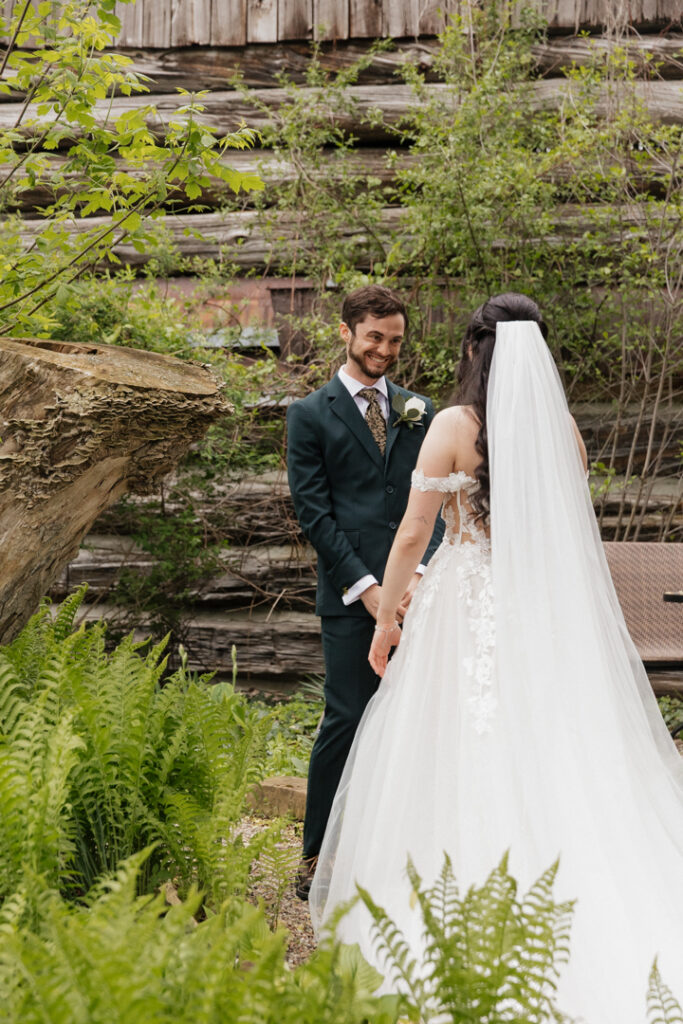 Bride and groom first look at The Herb Garden in Almonte, ON.