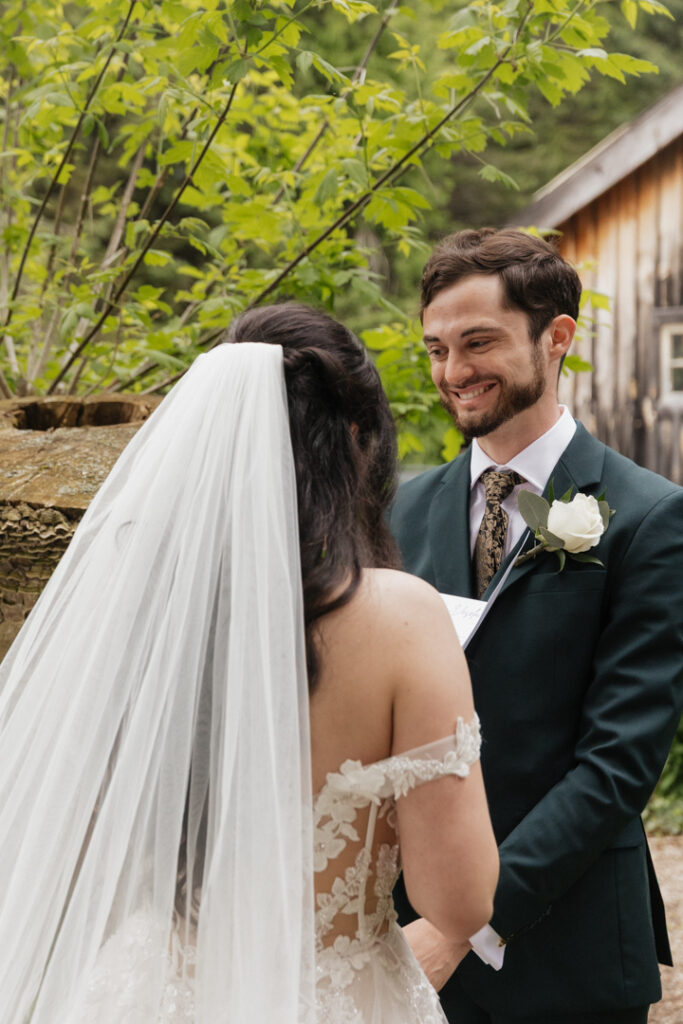 Bride and groom first look and vow reading at The Herb Garden in Almonte, ON.