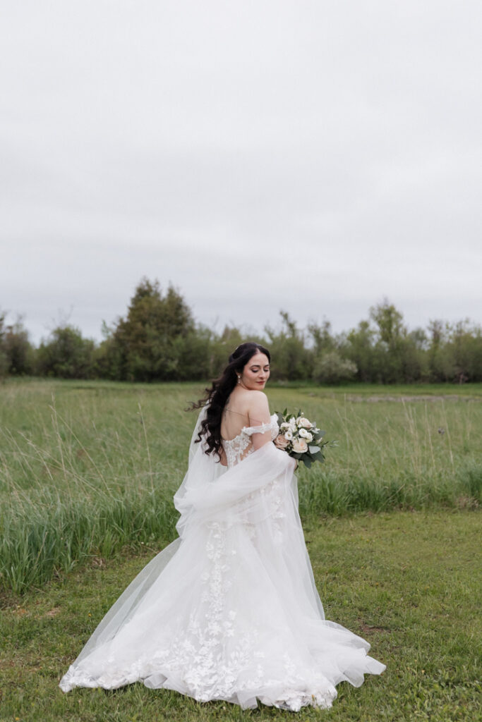 Bridal portrait in a field at The Herb Garden in Almonte, ON. 